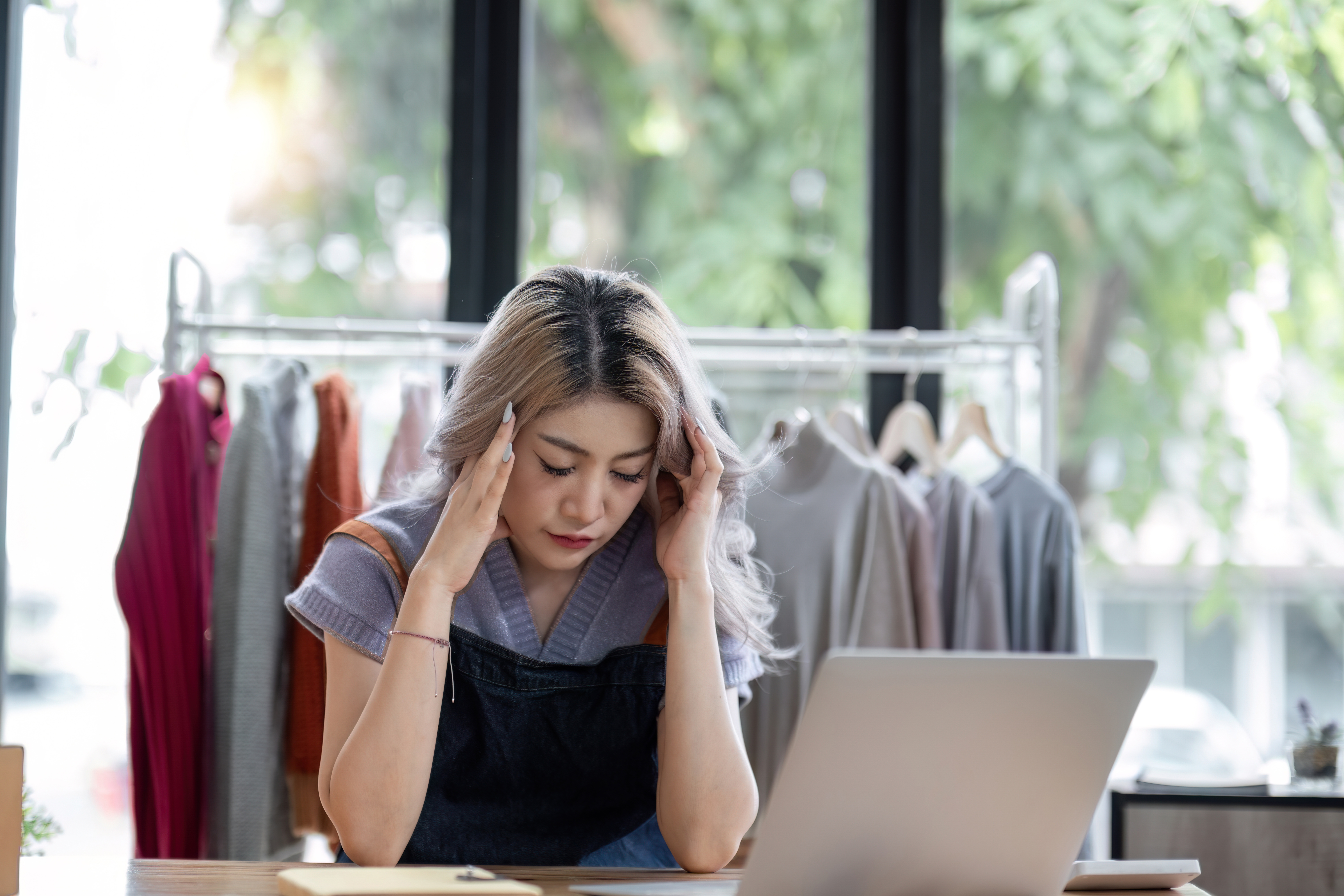 Stress Serious Asian Woman Doing Clothing Business