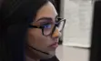 Female Communications employee taking a call