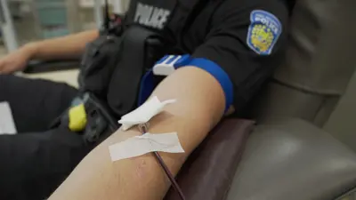 Police officer donating blood
